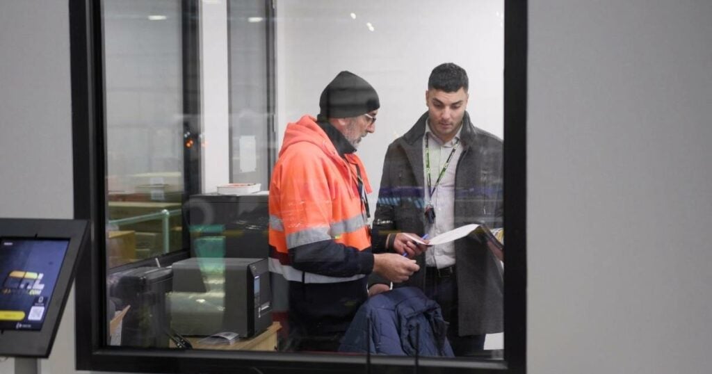 employees discussing training logistic operations