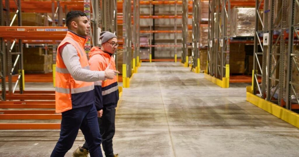 logistics employees checking around the warehouse implementing smooth operation