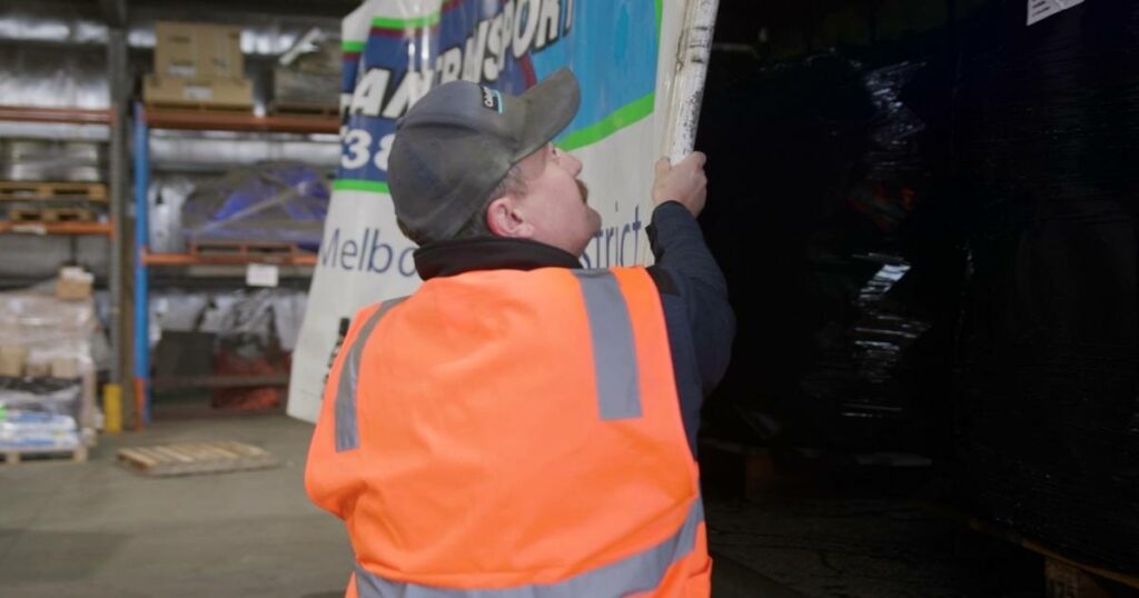 delivery driver preparing truckload for dispatch