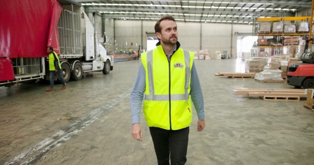 staff carefully inspecting the warehouse, utilizing logistics software to optimize inventory management