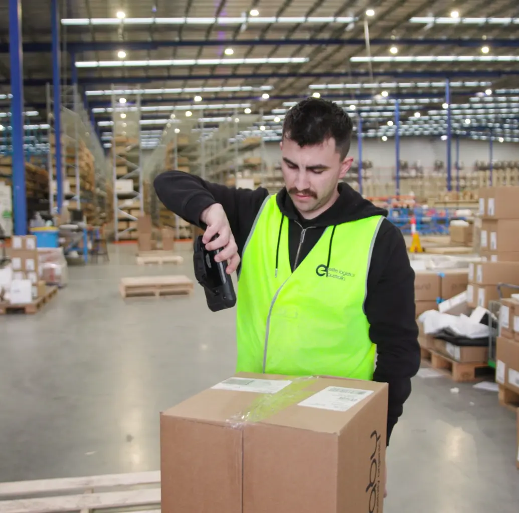 elite logistics employee scanning barcode