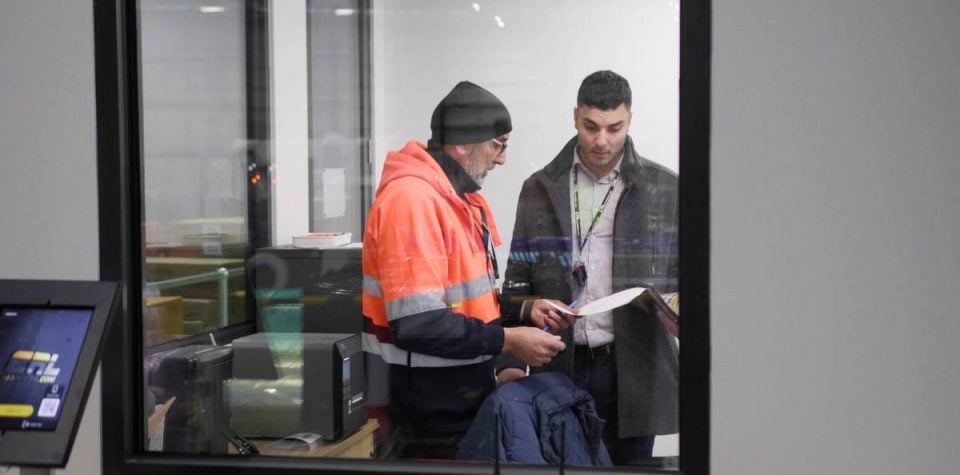 employees discussing training logistic operations