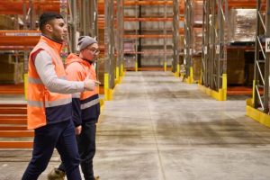 logistics employees checking around the warehouse implementing smooth operation