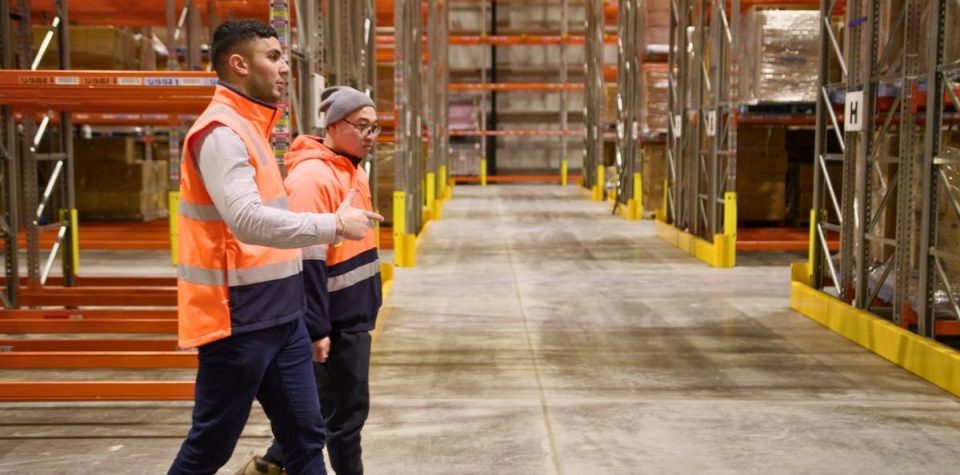 logistics employees checking around the warehouse implementing smooth operation