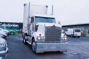 transport truck on the road, illustrating the role of logistics software in optimizing and managing the movement of goods