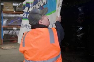 delivery driver preparing truckload for dispatch