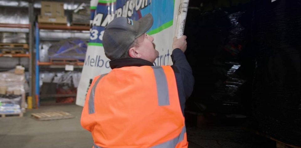 delivery driver preparing truckload for dispatch