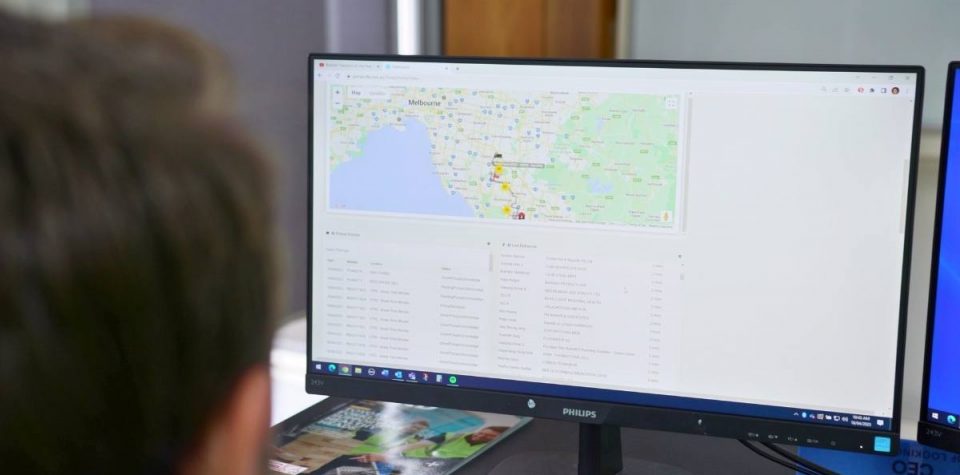 man engaged in utilizing logistics software on computer, demonstrating the integral role of technology in modern logistics management